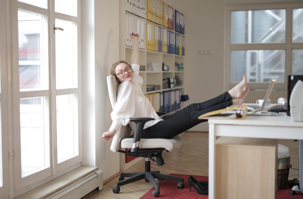 Woman sitting at desk smiling