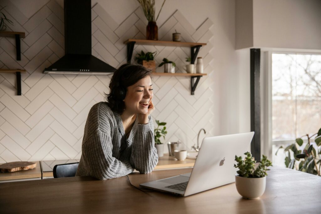 woman freelancer smiling at laptop